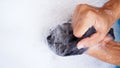 Top view of hand with shirt washing with detergent bubble in wash tub