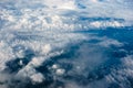 Above heaven, view from airplane to fluffy white clouds and blue atmosphere, nature skyline landscape