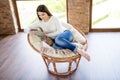 Above high angle view of her she nice attractive focused calm peaceful dreamy woman sitting on cosy pillow chair using Royalty Free Stock Photo