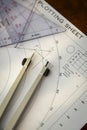 Above image of a navigator\'s radar plotting chart with a triangle and compass divider Royalty Free Stock Photo