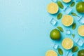 Above photo of heap of limes cubes of ice mint and drops isolated on the blue background with blank space Royalty Free Stock Photo