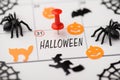 Above photo of label date 31 october with red pin halloween decor pumpkin witch spider spiderweb cat and bat isolated on the