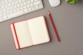 Above photo of plant keyboard computer mouse notebook and red pencil isolated on the grey background with copyspace Royalty Free Stock Photo