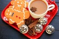 Above photo of three gingerbread men and coffee with star anise Royalty Free Stock Photo