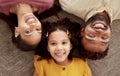 Above portrait of mixed race parents enjoying weekend with daughter in home living room. Smiling hispanic girl hugging Royalty Free Stock Photo