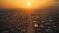 From above, the setting sun emphasizes the sprawling refugee camp and its organized tents. World Refugee Day