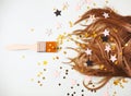 Bunch of hair and brush in confetti star