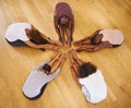 Above, studio and people stretching legs on floor in class to start dance practice or rehearsal in academy. Students Royalty Free Stock Photo