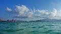 Above the turquoise surface of the sea are the pillars of the cable car from the mainland to the island.