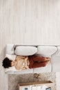 Above view, black woman and sofa of a person on phone wifi looking at web and social media app. Living room lounge couch