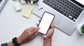 Top view businessman using smart phone at office desk. Royalty Free Stock Photo