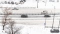Above view of cars driving at street in snowfall Royalty Free Stock Photo