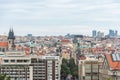 Above view of the cityscape of Prague on a sunny day. The detail view of modern and old part of town with traditional red rooftops