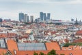 Above view of the cityscape of Prague on a sunny day. The detail view of modern and old part of town with traditional red rooftops
