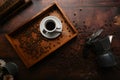 Coffee cup with roasted coffee beans and moka pot over rustic wooden background. Royalty Free Stock Photo