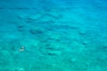 Above view of couple snorkeling in turquoise sea water, Glyka Nera, Chania, Crete.