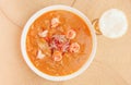 Above view of Ecuadorian food: shrimp cebiche with a glass of beer in wooden table background