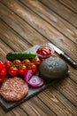 From above view of ingredients for beef black burger on a black stone board. Delicious food Royalty Free Stock Photo