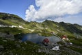 Above view of lake Balea in Fagaras mountains on a bright sunny day. Transylvania region. Royalty Free Stock Photo