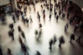 Above view of large group of unrecognizable people walking in big space. Motion blur. Generative Ai