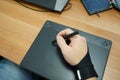 Above view of man hand designer use graphics tablet with touch screen Royalty Free Stock Photo