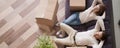 Above view married couple resting on couch at moving day Royalty Free Stock Photo