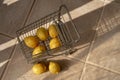 Miniature shopping cart filled with lemons Royalty Free Stock Photo