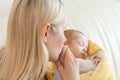 Above view of mother kissing her baby's hand Royalty Free Stock Photo