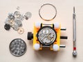 above view of open watch in yellow holder on table Royalty Free Stock Photo