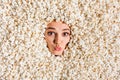 Above view photo of funky flirty girl pouted lips kiss face buried isolated on background full with pop corn Royalty Free Stock Photo