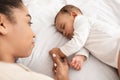 Above-View Of Sleeping African American Baby And Mother In Bed Royalty Free Stock Photo