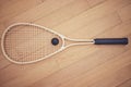 Above view of squash gear equipment on wooden floor in empty court in sports centre with copyspace. Two rackets and ball Royalty Free Stock Photo