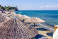 Umbrellas with loungers placed next to the coastline Royalty Free Stock Photo