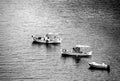 Above view of three small fishing boats in a row. Monochrome photo. Royalty Free Stock Photo