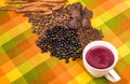 Above view of traditional Ecuadorian dish, colada morada and differente species over a colorful fabric Royalty Free Stock Photo