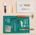 Above view of various tools for leatherwork