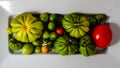 Above view of a white tray of red and green fresh picked variety of tomatoes Royalty Free Stock Photo