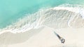 Above view of woman in white bikini sunbathing as laying on the beach, blue sea water in background -Summer fashion concept Royalty Free Stock Photo