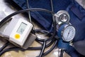 Above view of wrist blood pressure monitor showing normal blood pressure, with a stethoscope and tensiometer over a Royalty Free Stock Photo