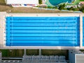 From above, you can see a group of swimmers training in a sports pool.