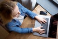 Above of young blond woman working with laptop Royalty Free Stock Photo