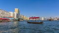 An Abra, water taxi in the middle of the Dubai Creek in the UAE Royalty Free Stock Photo