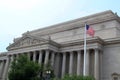 Lincoln Memorial on a Sunny Day with Blue Sky and American Flag Waving Royalty Free Stock Photo