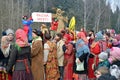 Abramtsevo, Moscow region, Russia, March, 13. 2016. People taking part in celebration of Bakshevskaya Shrovetide near straw effigy