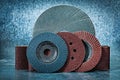 Abrasive discs and tapes on metalic background