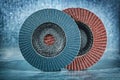 Abrasive flap discs on metalic background