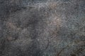 Abrasive texture roofing material close-up. Abstract dark granular background