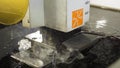 The abrasive water jet machine cutting the aluminium plate. Scene. The modern technology of sheet metal working process Royalty Free Stock Photo