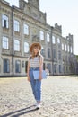 Study abroad concept. Student girl going outdoor at campus Royalty Free Stock Photo