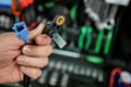 ABS sensor in the hands of an auto mechanic.